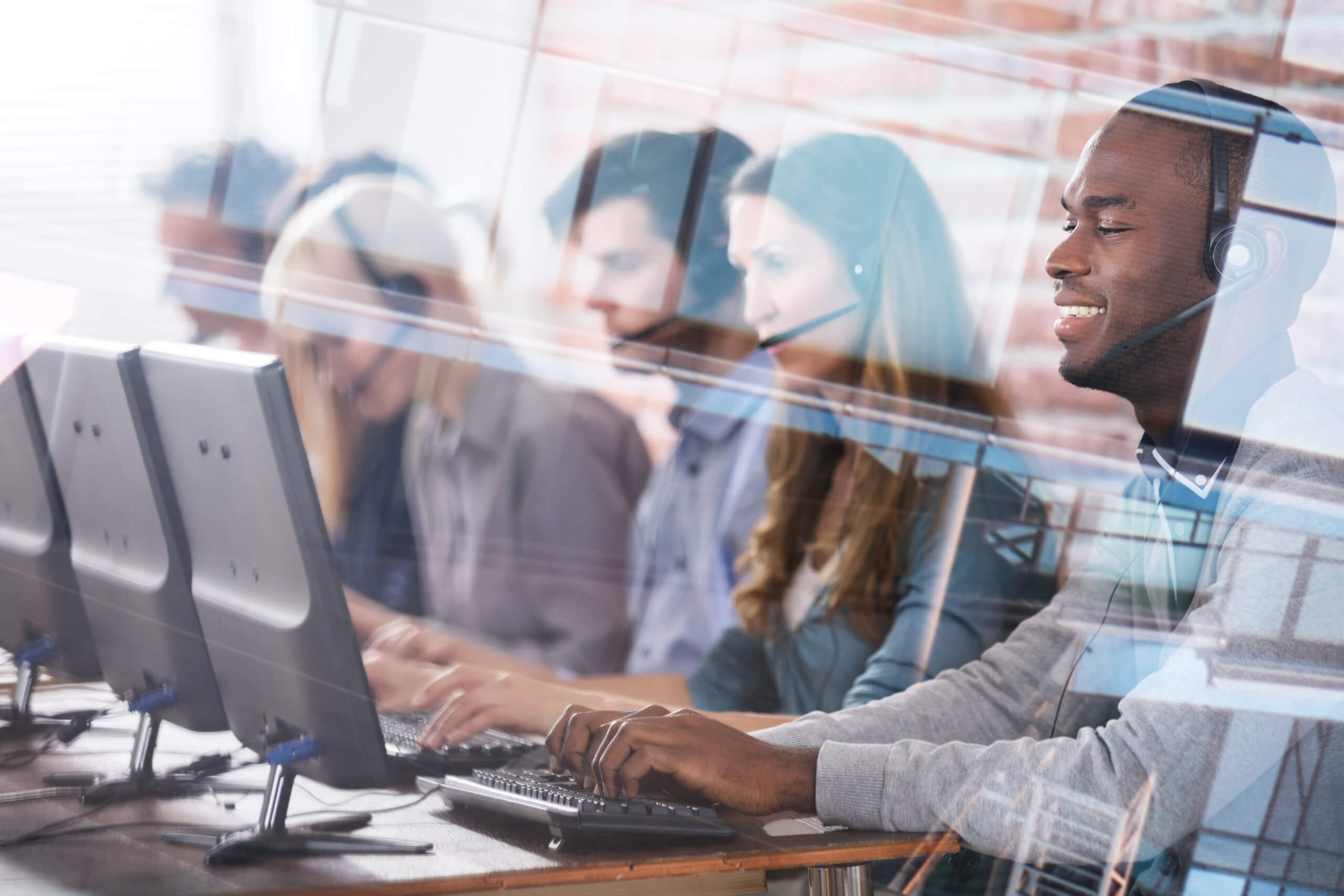 Young,Call,Center,Team,Talking,With,Customers People working in their computers