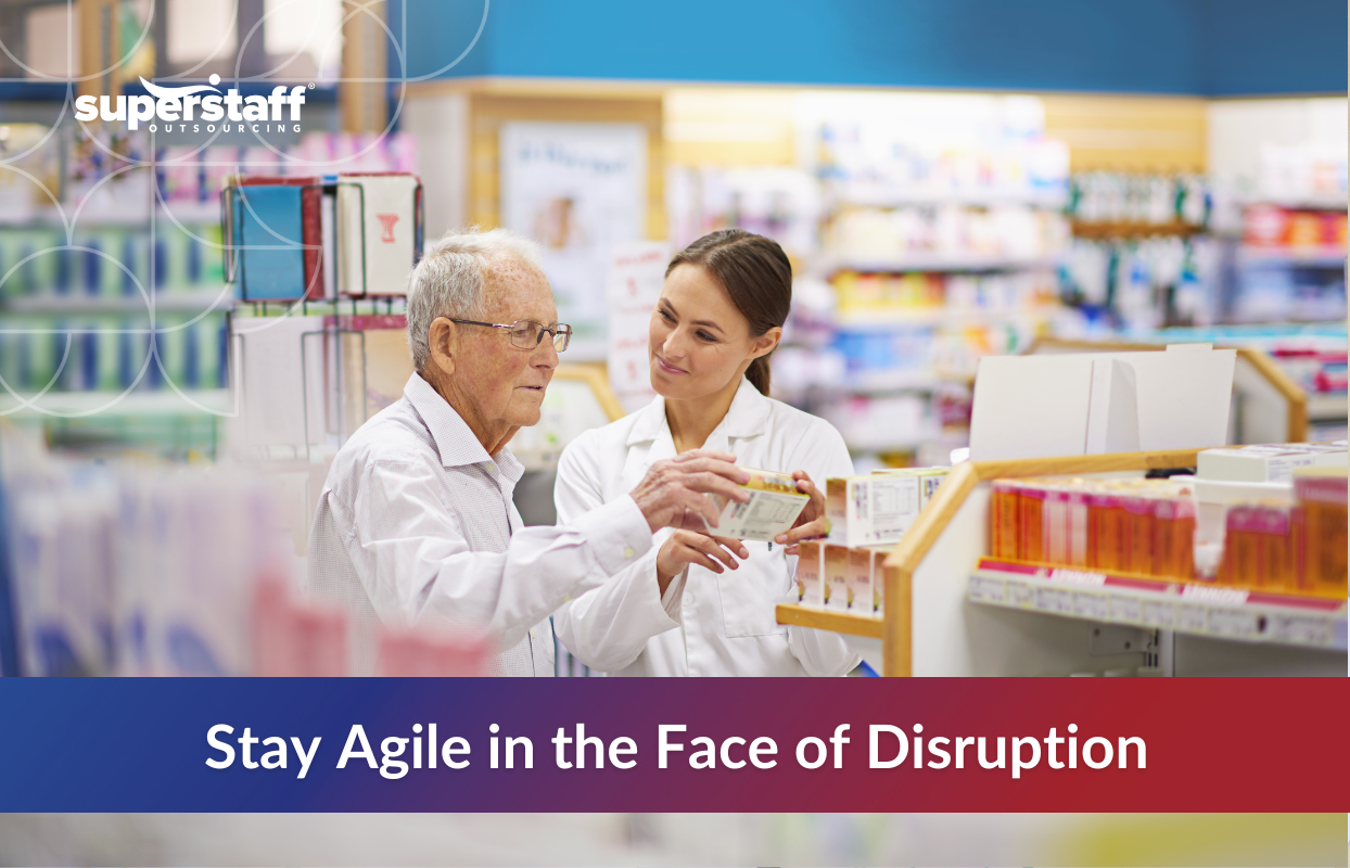 How Biopharma Companies Can Stay Agile_Featured Pharmacist assisting elderly man in a pharmacy, symbolizing patient-centered innovations and agility in biotech industry trends.