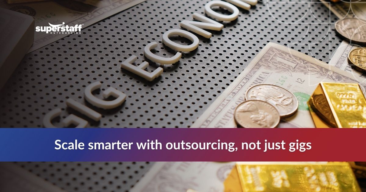 Close-up of the phrase 'Gig Economy' on a textured surface, surrounded by coins and gold bars, highlighting outsourcing.