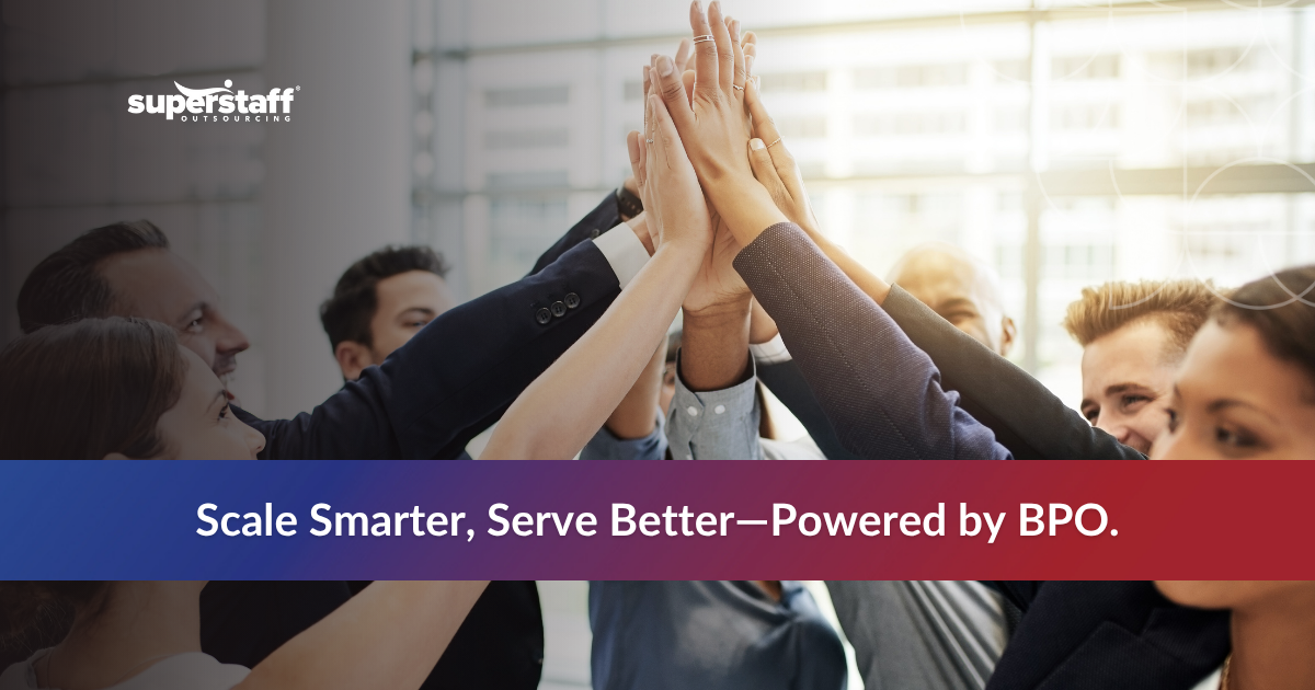 Group of diverse professionals celebrating teamwork with hands joined, emphasizing BPO advantages for business growth