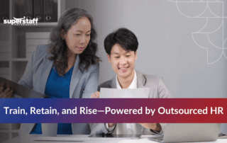 Team lead guiding and teaching a call center agent during training.