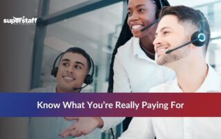 Call center agents collaborating together in a Philippine BPO office, highlighting the real outsource customer service cost.