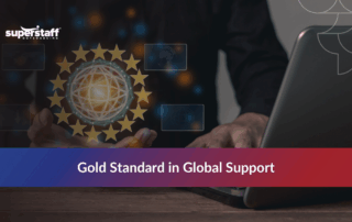 Man working on a laptop with gold star icons, representing excellence in Philippine outsourcing.