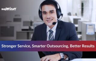 Agent wearing a headset, providing customer support outsourcing services in a professional office setting