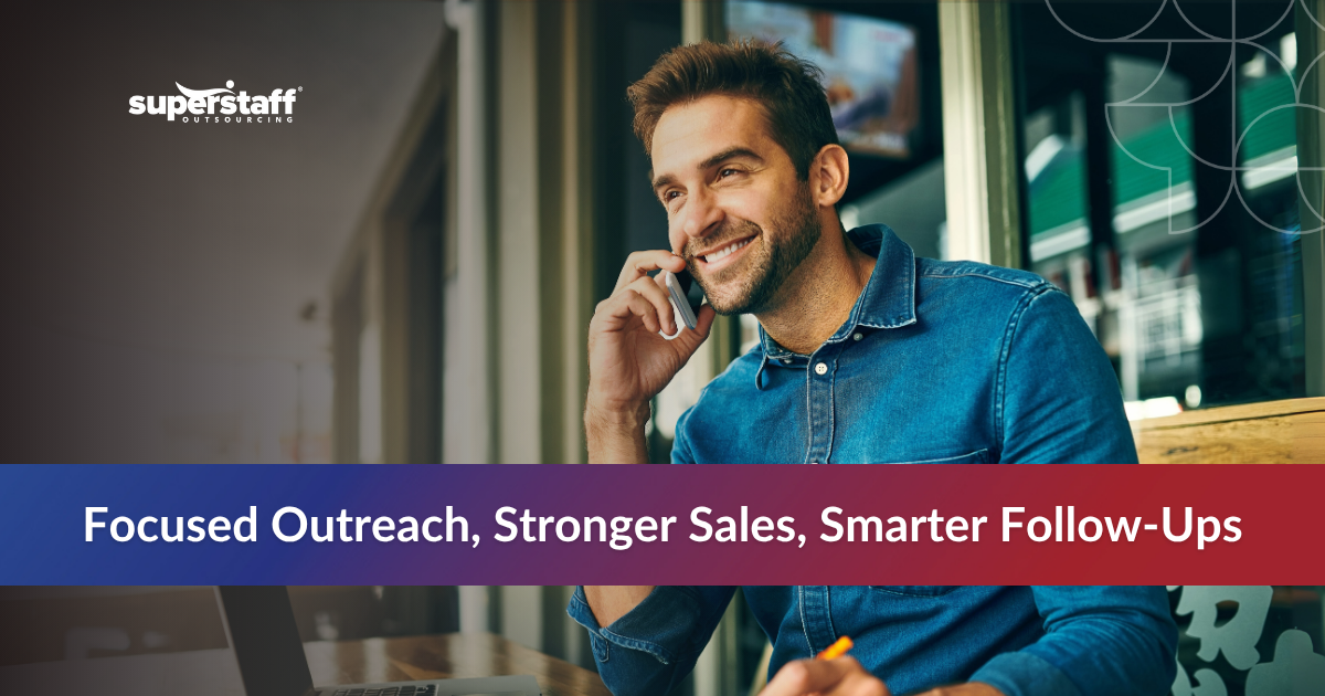 Smiling male agent taking a call at an outgoing call center