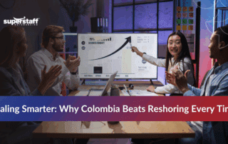 Tech startup team comparing nearshoring vs reshoring strategies to address talent shortages.