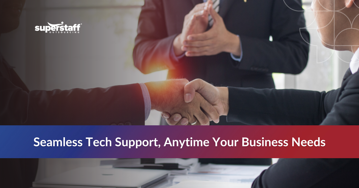 Two business professionals shaking hands with a busy office background illustrating the best tech support outsourcing partnership.