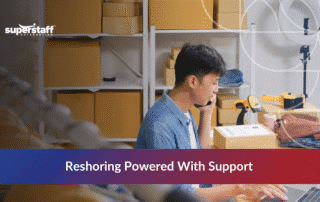 Small business owner managing reshoring supply chain operations with inventory and shipping boxes