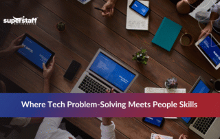 Technical support representative assisting a client at their workstation