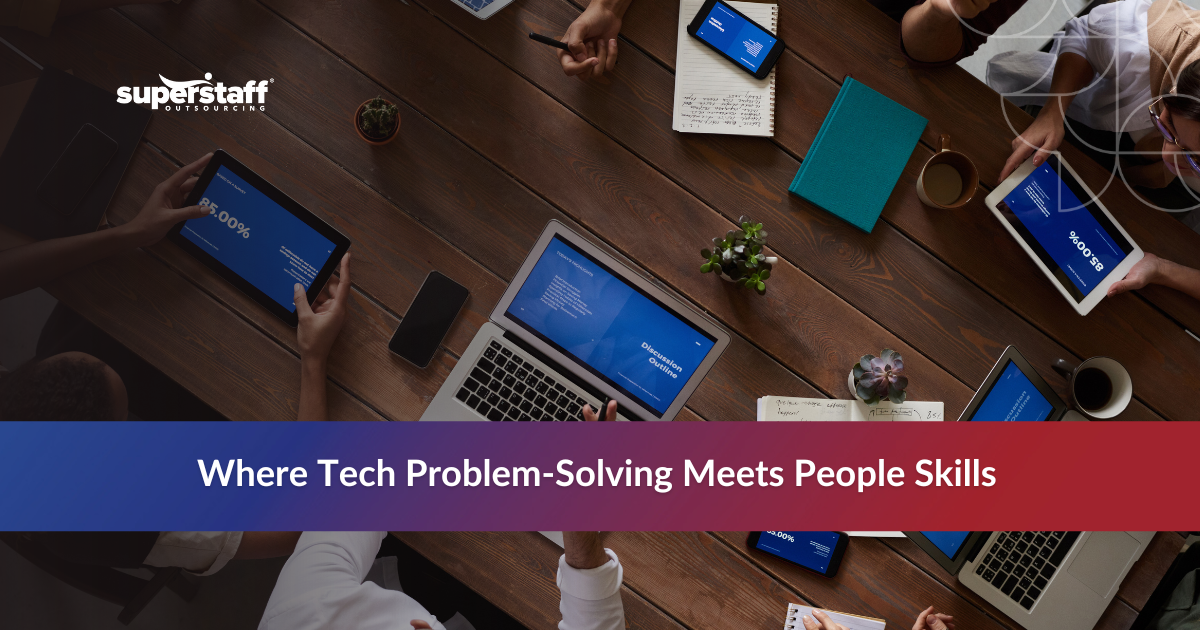 Technical support representative assisting a client at their workstation