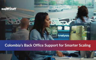 Back office workers in Colombia collaborating to support startups through outsourcing services.